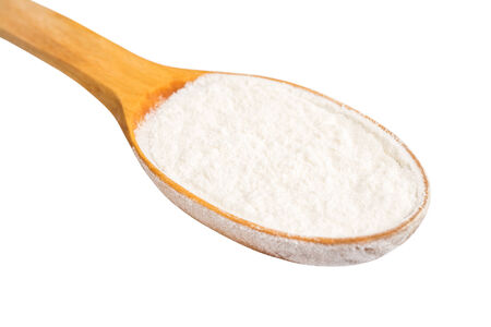 Wooden Spoon With Wheat Flour Powder Isolated On Whiteの写真素材