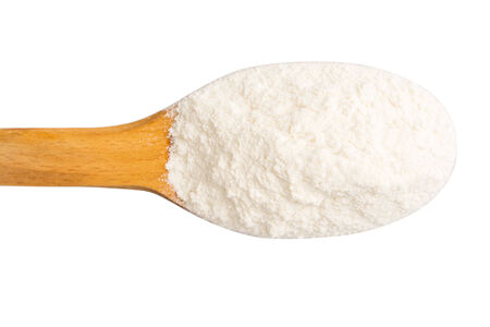 Wooden Spoon With Wheat Flour Powder Isolated On Whiteの写真素材