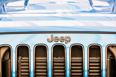 BUCHAREST, ROMANIA - APRIL 04, 2014  Jeep Wrangler Unlimited Sign Close Up  The Wrangler is a direct descendant of the World War II and is manufactured by American automaker Chrysler のeditorial素材