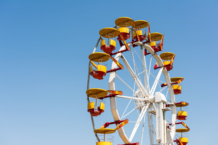 BUCHAREST, ROMANIA - JUNE 08, 2014  People Riding Giant Ferris Wheel In Youths Public Amusement Park...