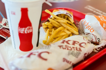 BUCHAREST, ROMANIA - JUNE 17, 2014  Kentucky Fried Chicken Restaurant Menu With Hamburger, Twister...