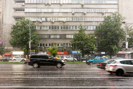 BUCHAREST, ROMANIA - JUNE 20, 2014  Rush Hour Traffic Downtown Bucharest On Magheru Avenue During Powerful Summer Storm のeditorial素材