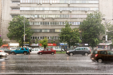 BUCHAREST, ROMANIA - JUNE 20, 2014  Rush Hour Traffic Downtown Bucharest On Magheru Avenue During Powerful Summer Storm のeditorial素材