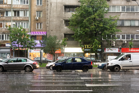 BUCHAREST, ROMANIA - JUNE 20, 2014  Rush Hour Traffic Downtown Bucharest On Magheru Avenue During Powerful Summer Storm のeditorial素材