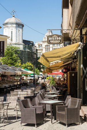 BUCHAREST, ROMANIA - JUNE 30, 2014  Restaurant Cafe Waiting For Customers Downtown Bucharest On Lipscani Street In The Old Town Center のeditorial素材