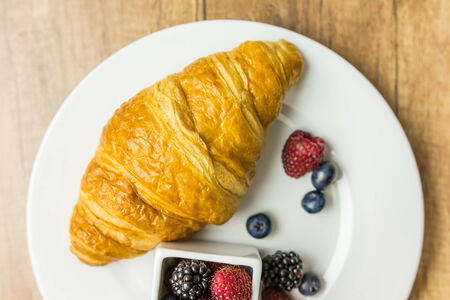 Croissant And Fresh Fruits Breakfastの写真素材