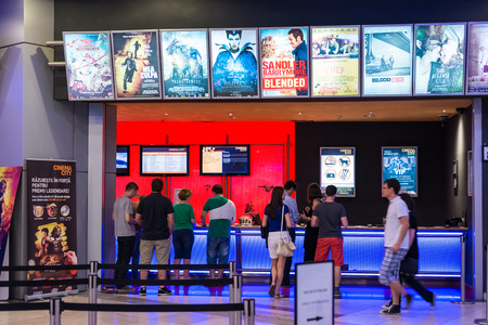 BUCHAREST, ROMANIA - AUGUST 10, 2014  People Buying Tickets At The Cinema Premiere Movies 