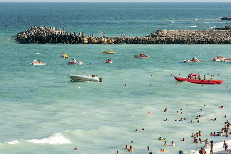 COSTINESTI, ROMANIA - JULY 28, 2014  People Have Fun At The Black Sea Beach In Costinesti Holiday Resort のeditorial素材