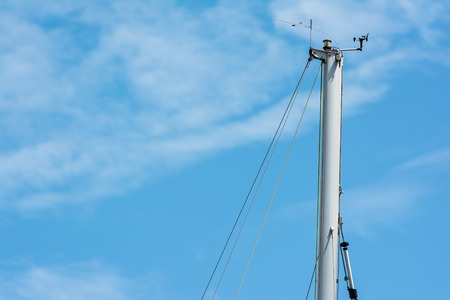 Yacht Flagpole Closeup On Blue Skyの写真素材