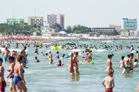 MAMAIA, ROMANIA - AUGUST 10, 2014: People Having Fun On Mamaia Beach At The Black Sea.のeditorial素材