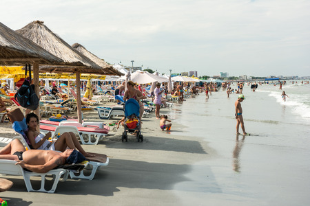 MAMAIA, ROMANIA - JULY 29, 2014: People Having Fun On Mamaia Beach At The Black Sea.のeditorial素材