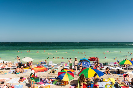 MAMAIA, ROMANIA - JULY 30, 2014: People Having Fun On Mamaia Beach At The Black Sea.のeditorial素材
