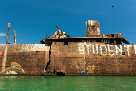 COSTINESTI, ROMANIA - JULY 31, 2014: The Old Shipwreck Near The Black Sea Beach. Opposite to the northern beach, the shipwreck of Evangelia, a Greek ship beached there in the late 1960s.のeditorial素材