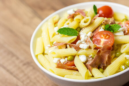 Italian Pasta Salad With Mozzarella, Bacon And Tomatoesの写真素材