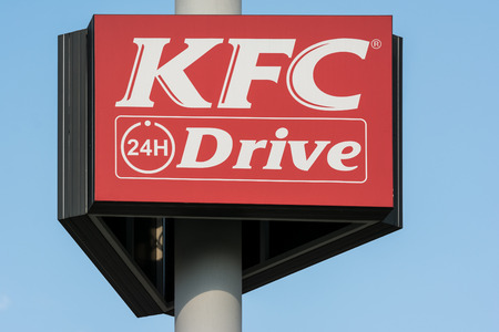 BUCHAREST, ROMANIA - AUGUST 06, 2014: Kentucky Fried Chicken Restaurant Sign. It is a fast food restaurant chain headquartered in United States specialized in chicken products.のeditorial素材