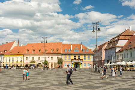 SIBIU, ROMANIA - AUGUST 18, 2014: The Main Square in the historical center was first mentioned in 1408 and is the largest public square which held public meetings, markets and public executions.のeditorial素材