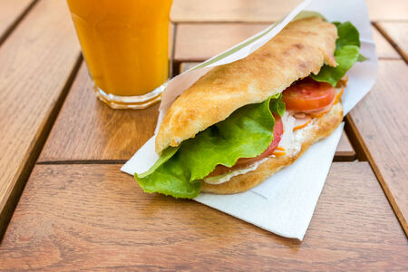 Salad Sandwich With Tomato Slices And Orange Juiceの写真素材