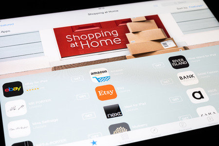 BUCHAREST, ROMANIA - DECEMBER 08, 2014: The New Shopping At Home Category In Apple Application Store On Apple iPad Air Tablet Integrates The Most Important Online Shopping Applications.のeditorial素材