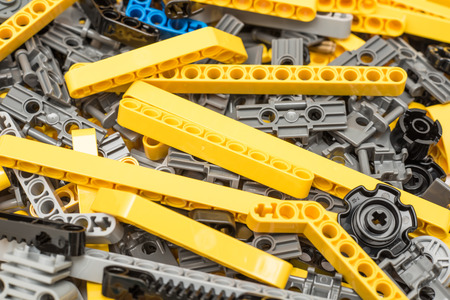 BUCHAREST, ROMANIA - DECEMBER 09, 2014: Lego Technic Pieces Pile Close Up. Technic is a line of Lego interconnecting plastic rods and parts that creates more advanced models with complex movable arms.のeditorial素材