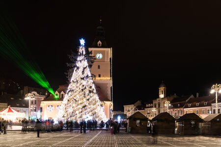 BRASOV, ROMANIA - DECEMBER 22, 2014:  Downtown Brasov City At Night With Christmas Tree Decorations. Brasov Is One Of The Main Touristic Cities Of Romania In The Carpathian Mountains.のeditorial素材