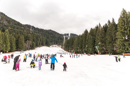POIANA BRASOV, ROMANIA - DECEMBER 23, 2014:  People Having Fun On Snowy Mountain Sky Resort In Poiana Brasov.のeditorial素材