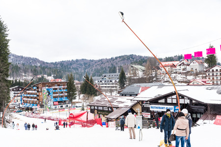 PREDEAL, ROMANIA - DECEMBER 23, 2014:  People Having Fun Skiing On Snowy Mountain Sky Resort In Predeal.のeditorial素材
