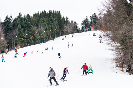 PREDEAL, ROMANIA - DECEMBER 23, 2014:  People Having Fun Skiing On Snowy Mountain Sky Resort In Predeal.のeditorial素材