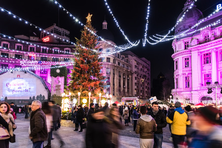 BUCHAREST, ROMANIA - DECEMBER 22, 2014:  Downtown Bucharest City At Night In The University Square With Christmas Tree Decorations.のeditorial素材