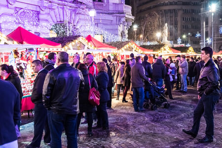 BUCHAREST, ROMANIA - DECEMBER 22, 2014:  Christmas Market Downtown Bucharest City At Night In The University Square.のeditorial素材