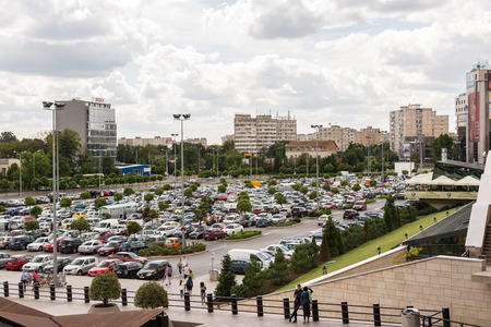 TIMISOARA, ROMANIA - AUGUST 24, 2014: Lots Of Cars Parked In Large Public Parking Lot.のeditorial素材
