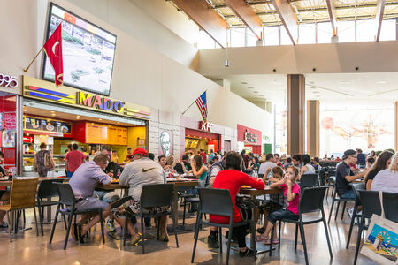 TIMISOARA, ROMANIA - AUGUST 24, 2014: People Crowd Eating Fast Food On Restaurant Floor In Luxurious Shopping Mall.のeditorial素材