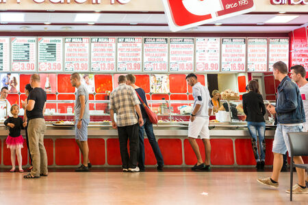 TIMISOARA, ROMANIA - AUGUST 24, 2014: People Crowd Eating Fast Food On Restaurant Floor In Luxurious Shopping Mall.のeditorial素材