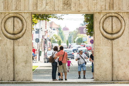 TARGU JIU, ROMANIA - AUGUST 26, 2014: The Gate of the Kiss is a stone sculpture made by Constantin Brancusi in 1938 and symbolizes the triumph of life over death.のeditorial素材