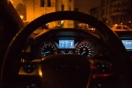 BUCHAREST, ROMANIA - JANUARY 28, 2015: Close Up Of Ford Focus Compact Car Dashboard Lights In The Night.のeditorial素材