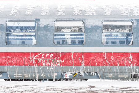BUCHAREST, ROMANIA - DECEMBER 29, 2014: Ice Frozen Train During Heavy Snowfall In Bucharest North Railway Station.のeditorial素材