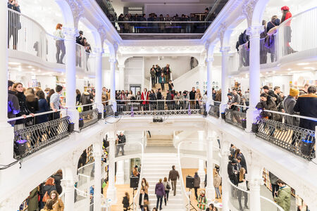 BUCHAREST, ROMANIA - FEBRUARY 12, 2015: People Crowd Rush On Shopping Literature Books In Library.のeditorial素材