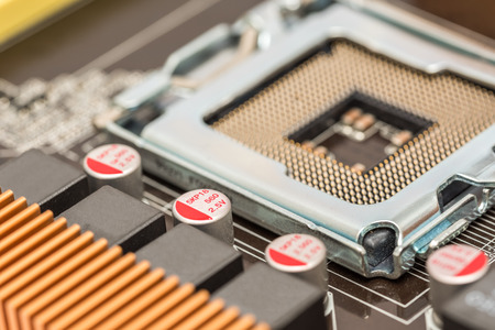 CPU Socket And Capacitors On Computer Motherboard