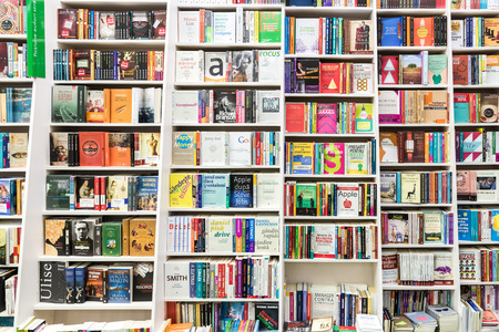 BUCHAREST, ROMANIA - JANUARY 23, 2015: Famous Books For Sale On Library Shelf.のeditorial素材