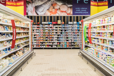 BUCHAREST, ROMANIA - FEBRUARY 25, 2015: Supermarket Food In Refrigerators On Store Aisle. BUCHAREST, ROMANIA - FEBRUARY 25, 2015: Supermarket Food In Refrigerators On Store Aisle.