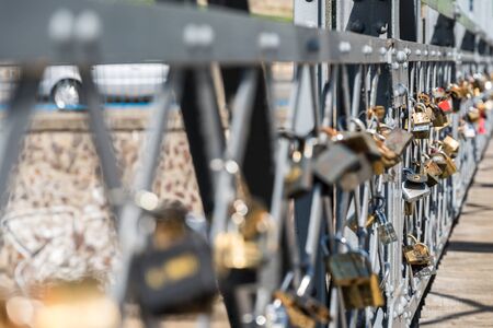 CLUJ NAPOCA, ROMANIA - APRIL 13, 2015: Elisabeta Bridge On Somes River In Cluj Napoca City Is A Place Where Young People Hang A Lock On Valentines Day To Symbolize Their Love.のeditorial素材