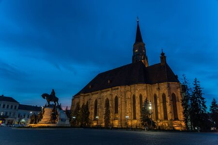 CLUJ NAPOCA, ROMANIA - APRIL 14, 2015: Sunset Blue Hour At Saint Michael Roman Catholic Church Built In Gothic Style In 1390.のeditorial素材