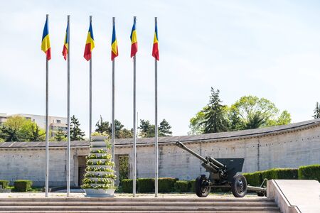 Romanian Flags And War Cannon At The Mausoleum Of Romanian Heroes in Bucharestのeditorial素材