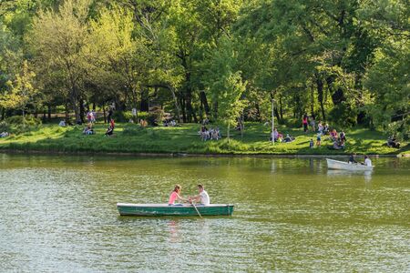 BUCHAREST ROMANIA  MAY 08 2015: People Boat Ride On Carol Public Park Lake On Spring Day.のeditorial素材