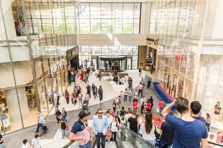 BUCHAREST ROMANIA  MAY 14 2015: People Crowd On Escalators In Luxury Shopping Mall.