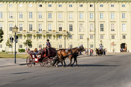 VIENNA, AUSTRIA - AUGUST 20, 2015: Horses and Classic Carriage Transport at Hofburg Palace the former imperial palace in the centre of Vienna.のeditorial素材