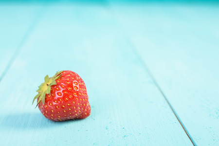 Fresh Red Strawberry On Blue Wood Boards Backgroundの写真素材