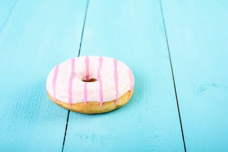 White And Pink Donut On Blue Backgroundの写真素材