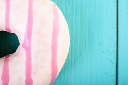 White And Pink Donut On Blue Backgroundの写真素材