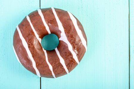 Chocolate Donut On Blue Backgroundの写真素材