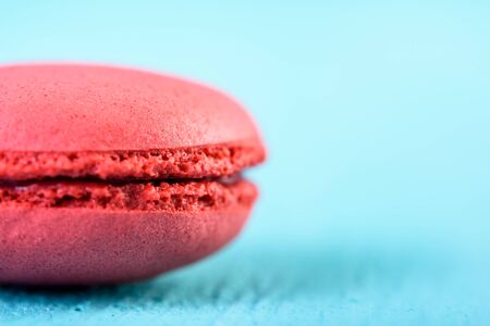 Red French Macaroon On Blue Backgroundの写真素材